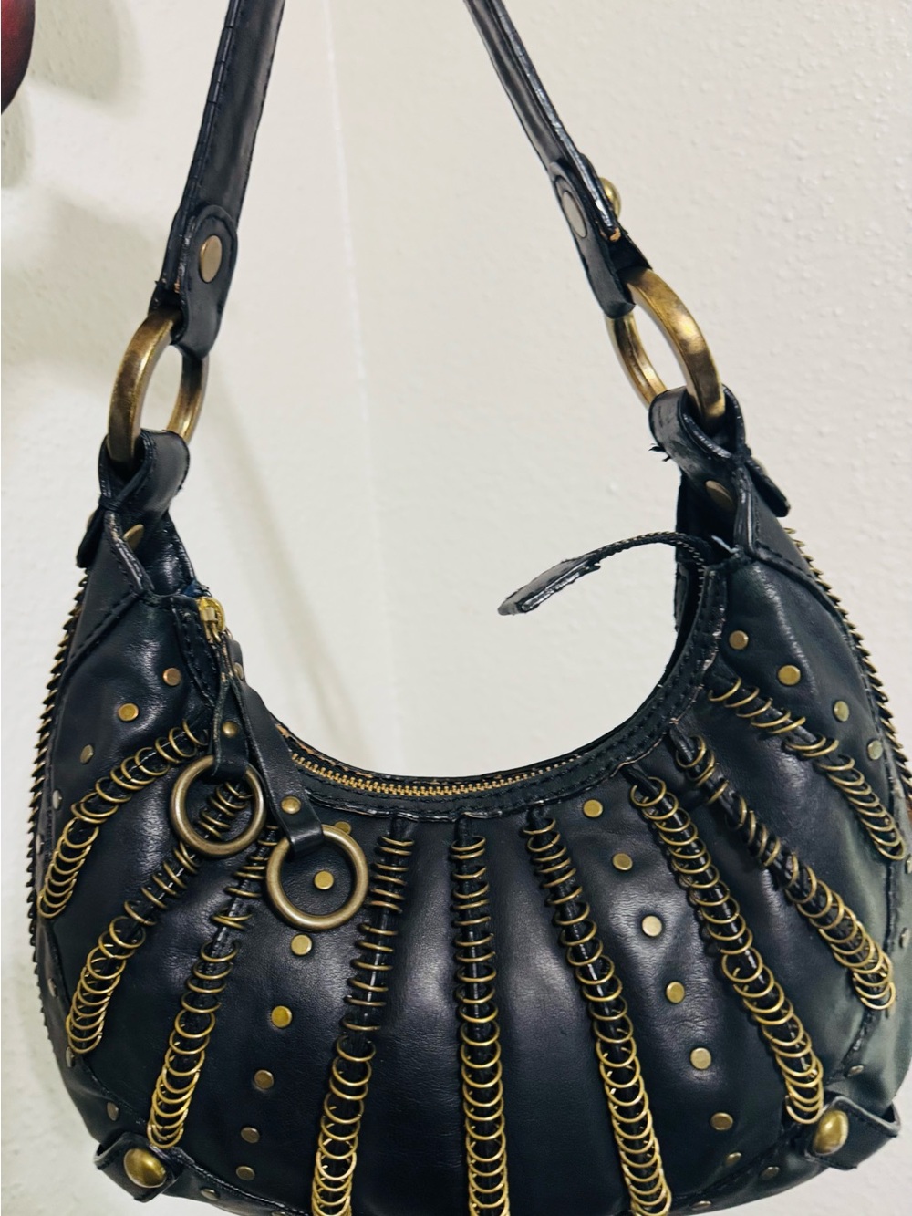 Isabella Fiore Black Leather Crescent Shoulder Bag with Gold Coil Accents